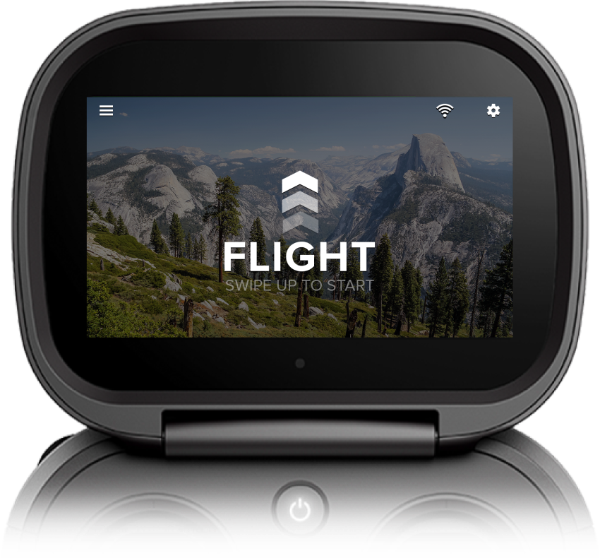 Drone controller flight interface shown against a mountain landscape