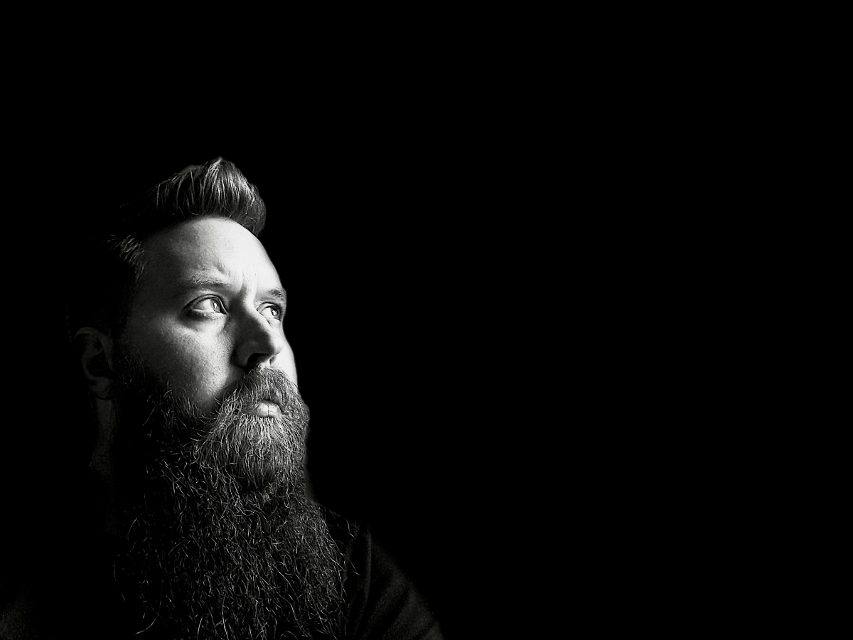 dramatic black and white portrait of John Wayne Hill